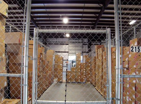 Interior of a warehouse with long rows of shelving